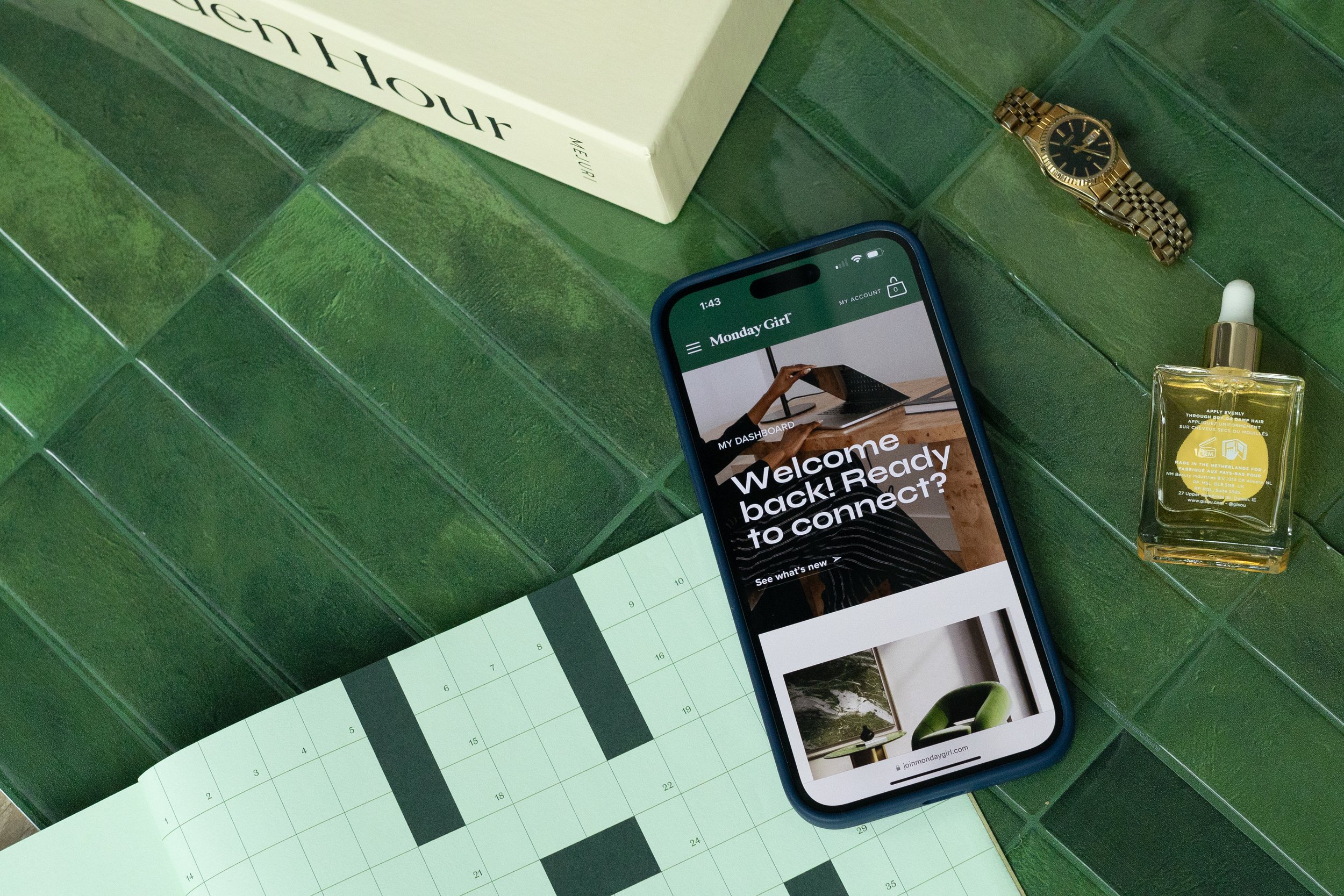  Phone displaying the Monday Girl member dashboard on green background 
